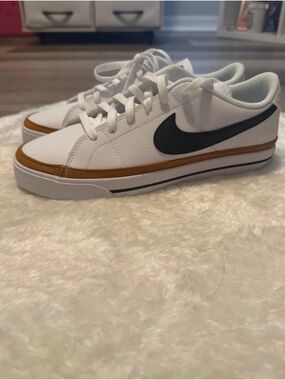 Nike White Low-Top Sneakers with Black Swoosh and Brown Trim